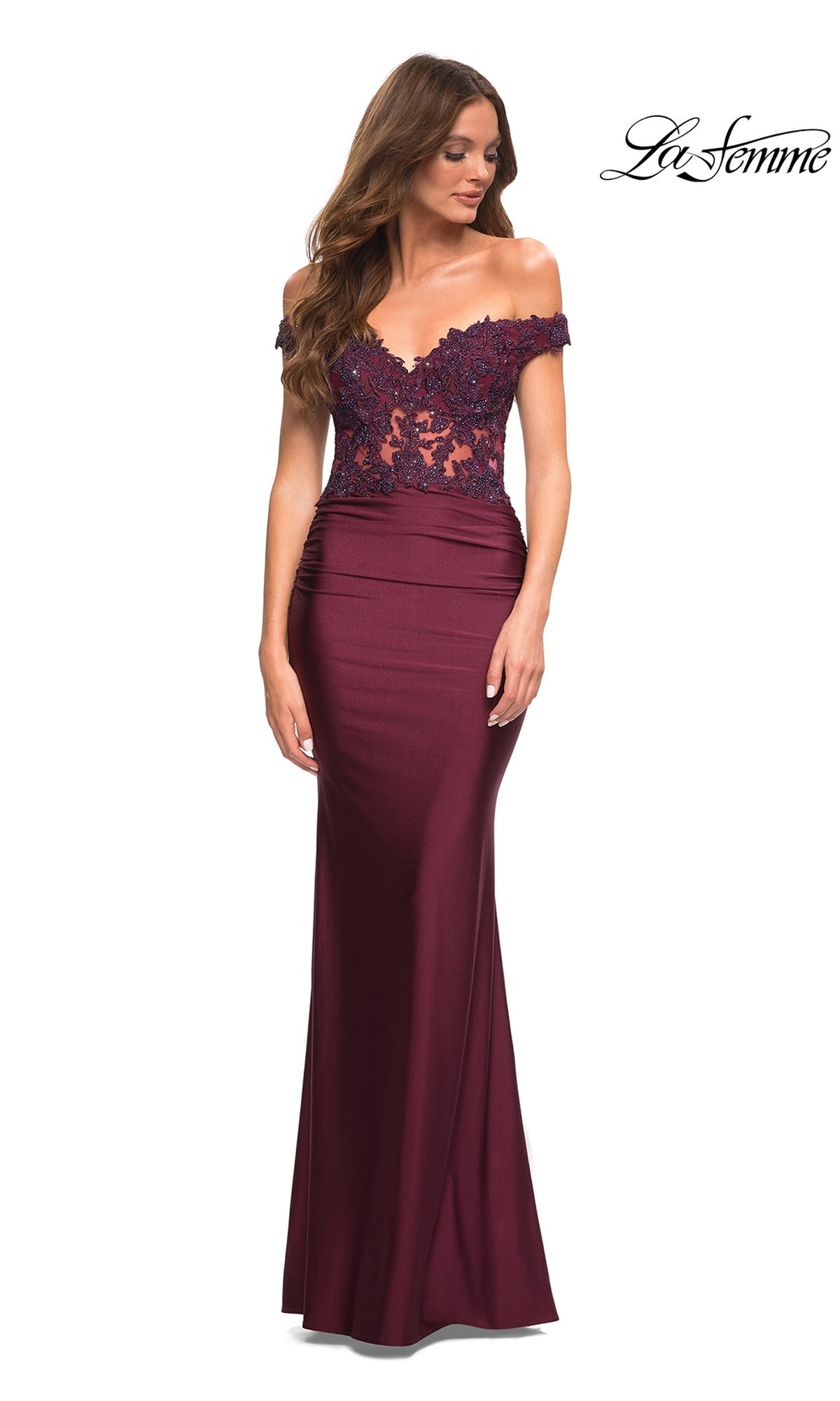 A woman models the burgundy Lace-Bodice La Femme Off-the-Shoulder Prom Dress with a sheer lace bodice and fitted skirt against a white background. The